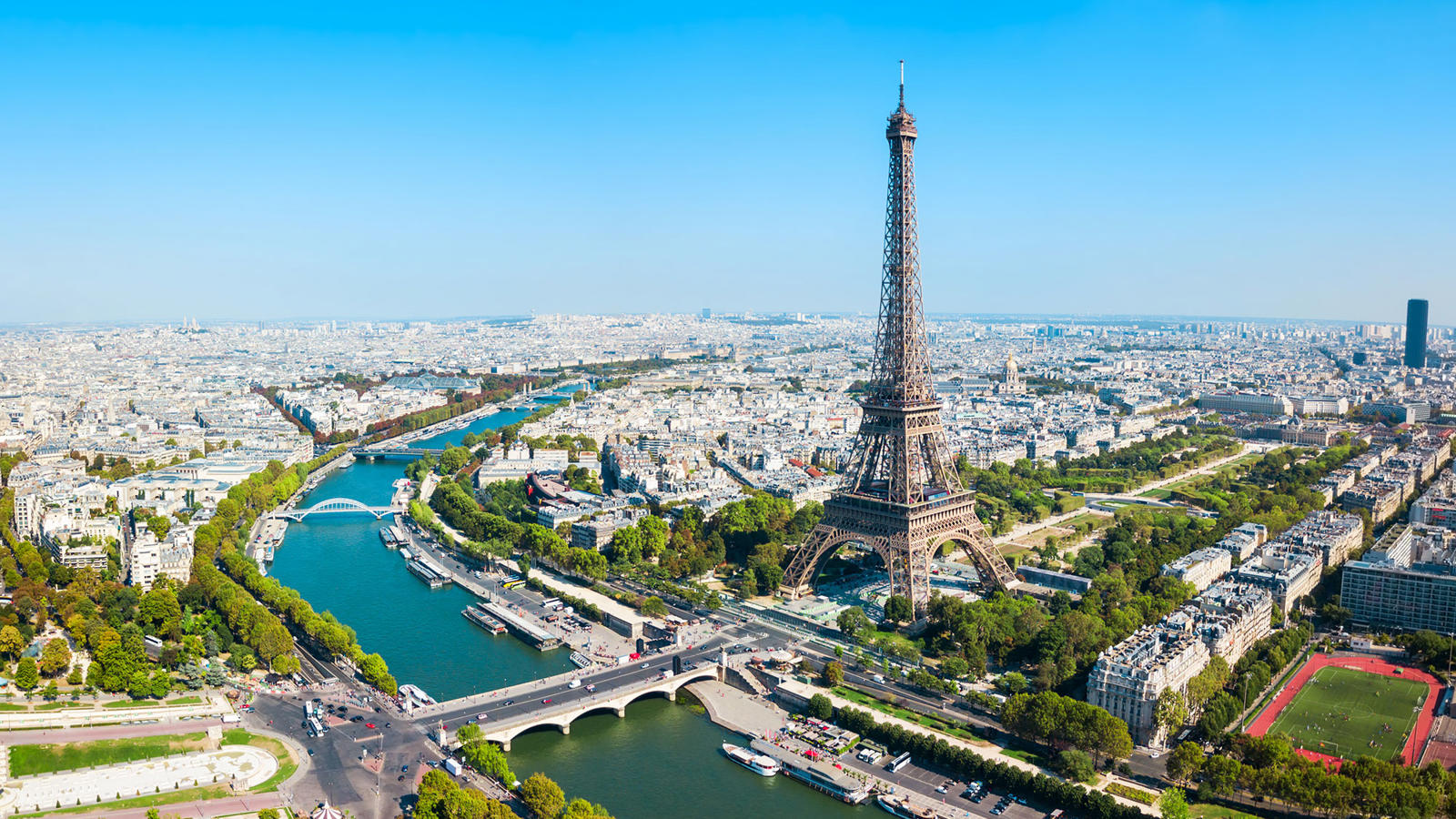 a large city with a river and a tower