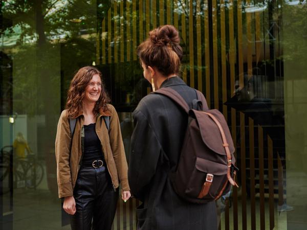 a woman talking to another woman