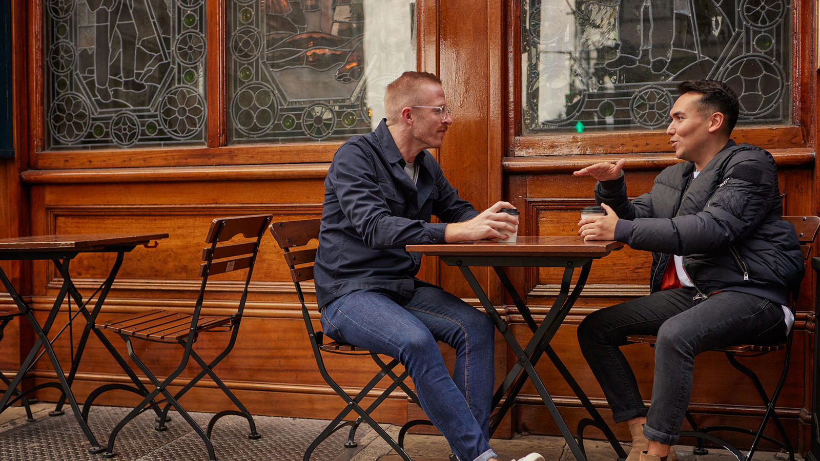 two men sitting at a table